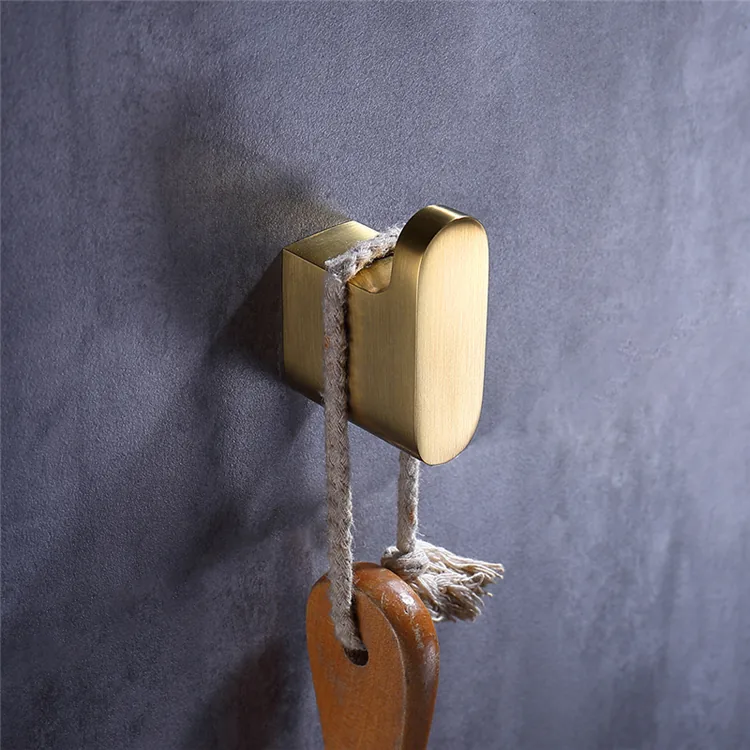 Matching gold towel bars hooks and holders