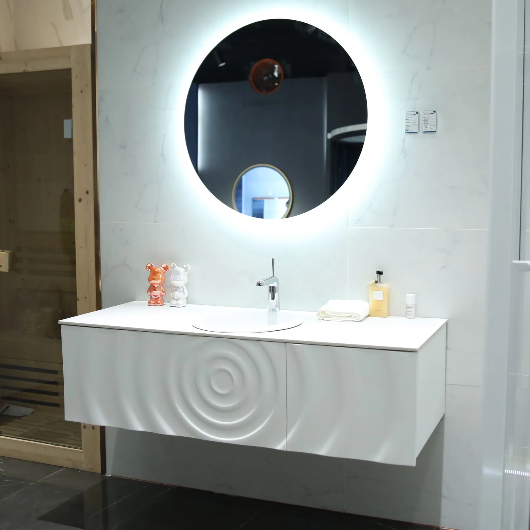 Close view of a modern bathroom vanity basin and cabinet finish